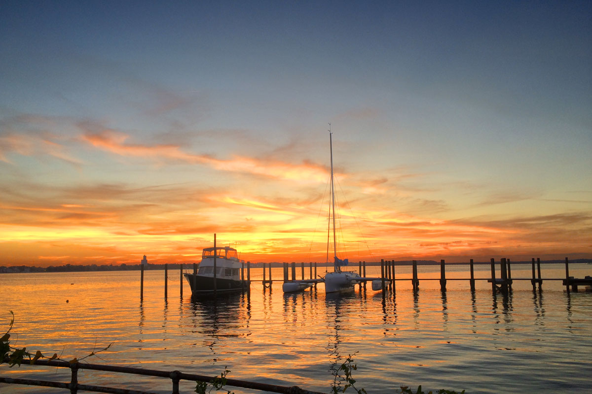 Boats in slips at sunset